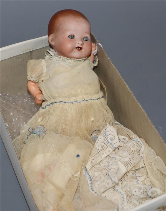 A small Armand Marseille baby doll with open mouth